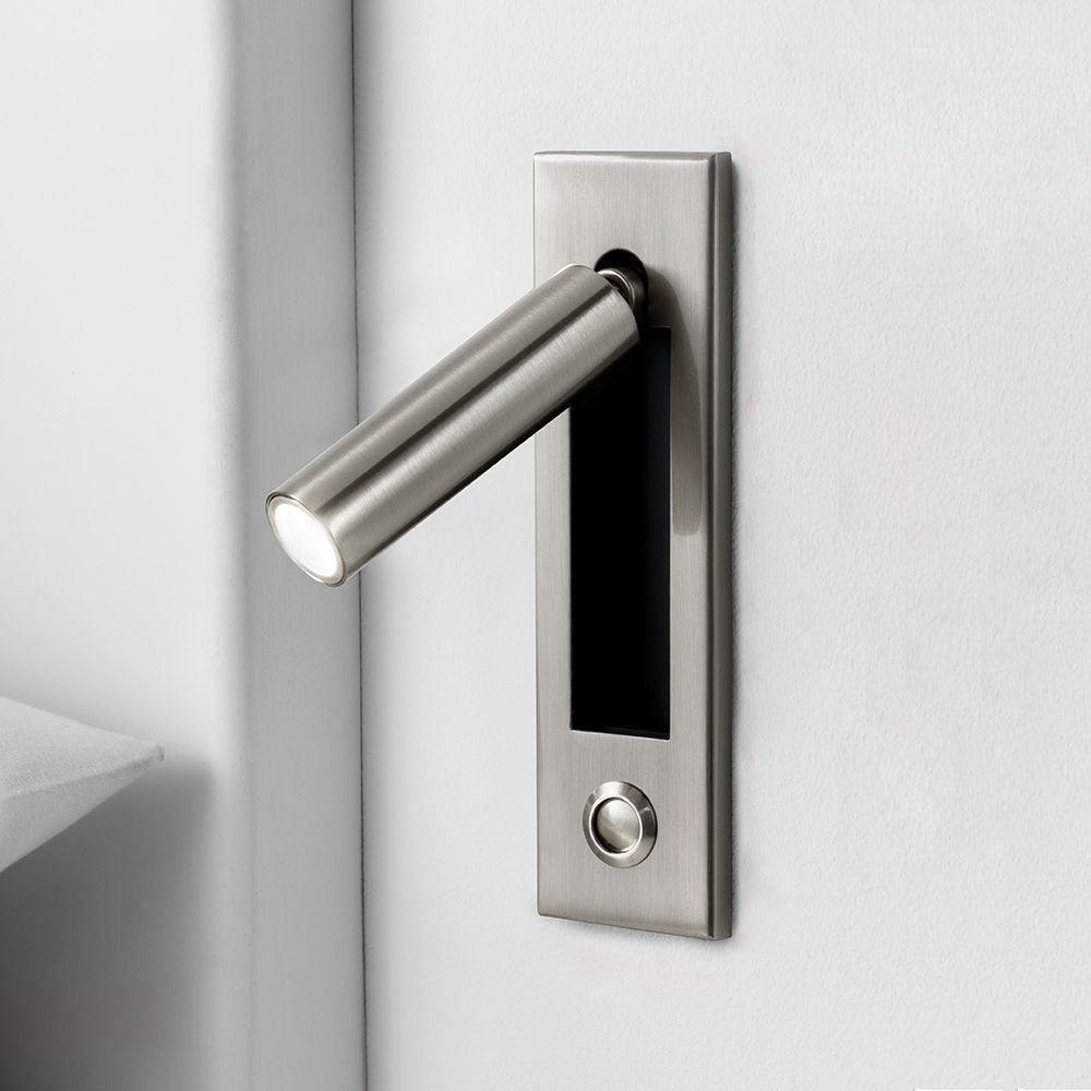 Metal door handle on a white door