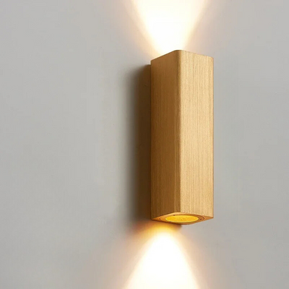Wooden wall light fixture on a gray wall