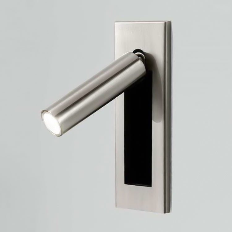 Modern wall-mounted light fixture with a metallic finish on a gray background