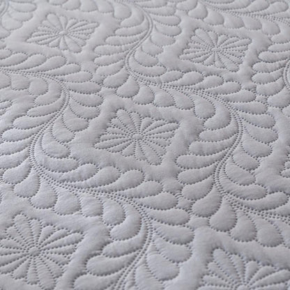 Close-up of textured gray fabric with floral patterns