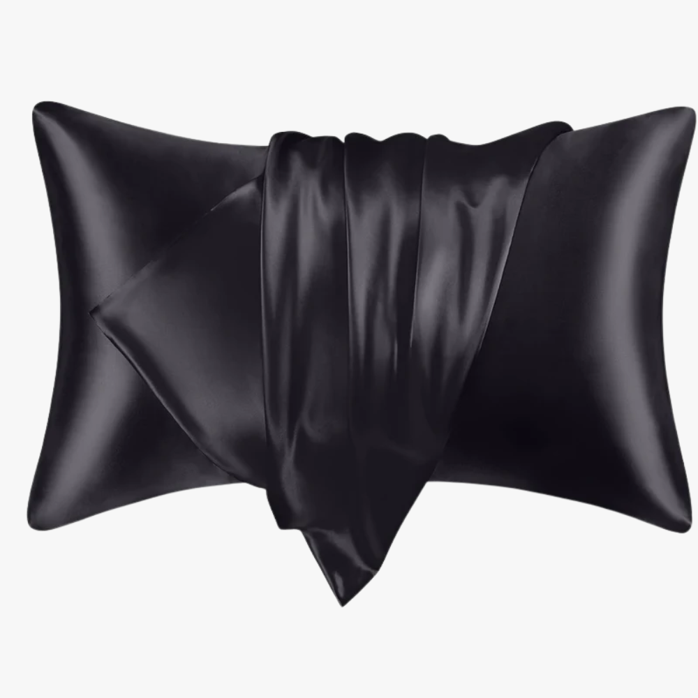 Black satin pillow on a white background