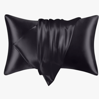 Black satin pillow on a white background