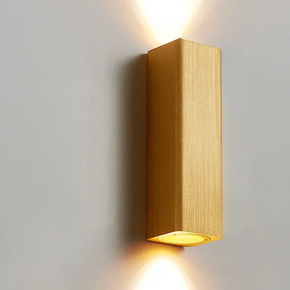 Wooden wall light fixture on a gray wall