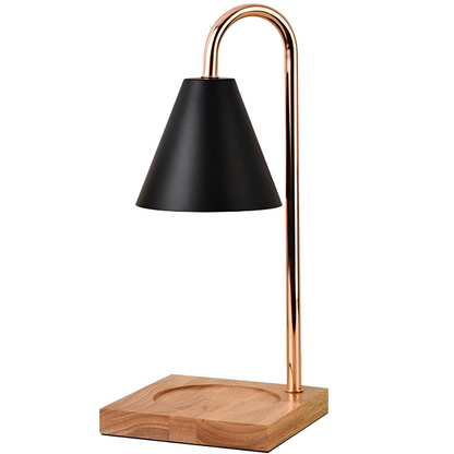 Table lamp with black shade, copper neck, and wooden base on a white background