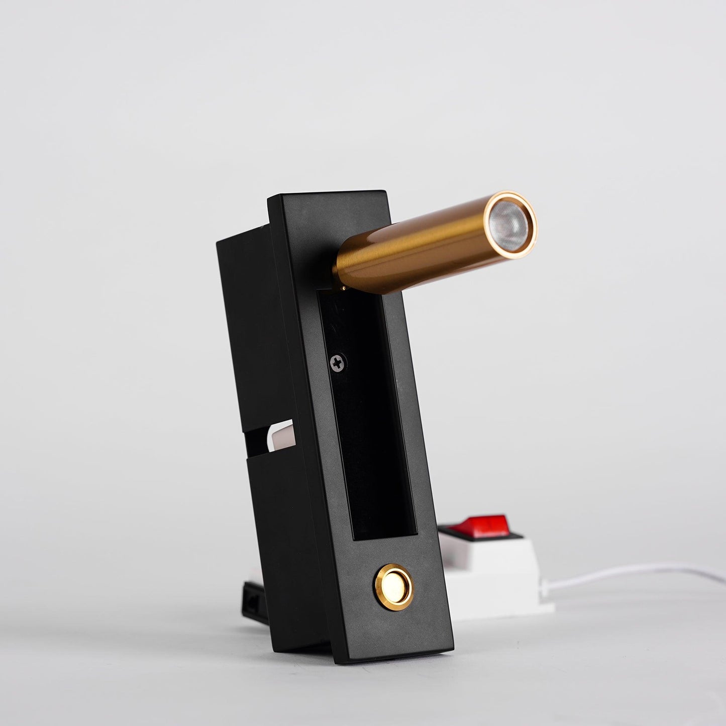 Modern door handle with black finish and gold accents on a white background