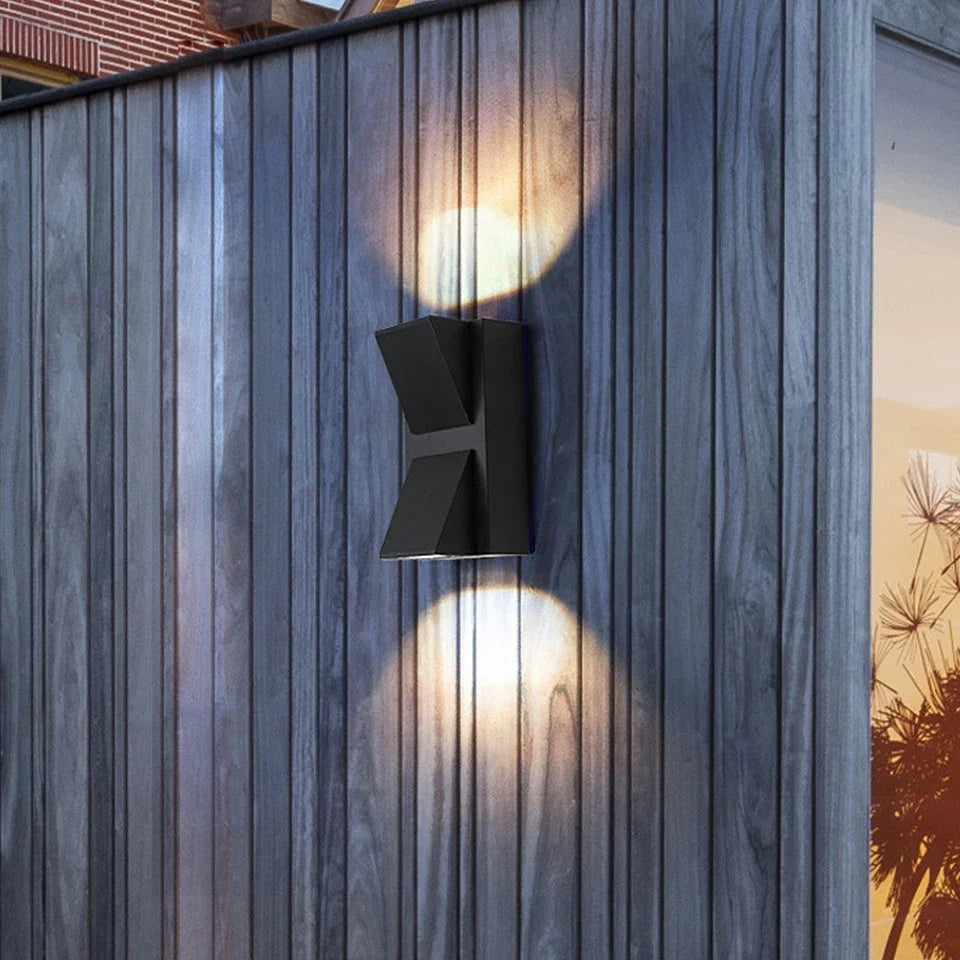 Modern outdoor wall light fixture on a wooden wall