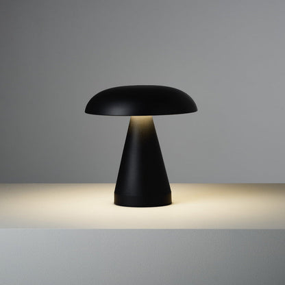 Black table lamp with a mushroom-shaped design on a gray background