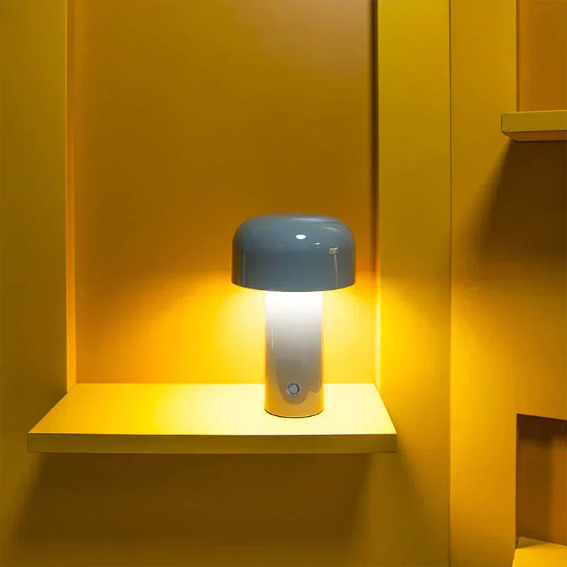 Blue lamp on a yellow shelf against a yellow wall