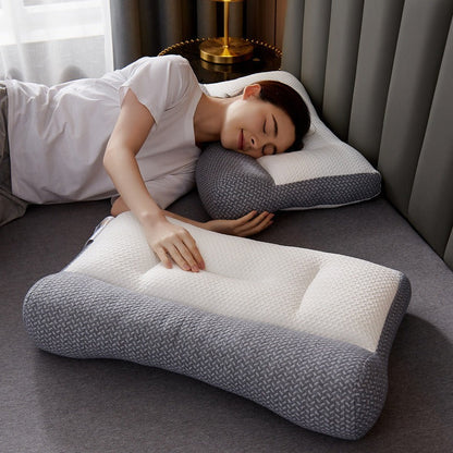 Woman using a gray and white pillow in a bedroom setting
